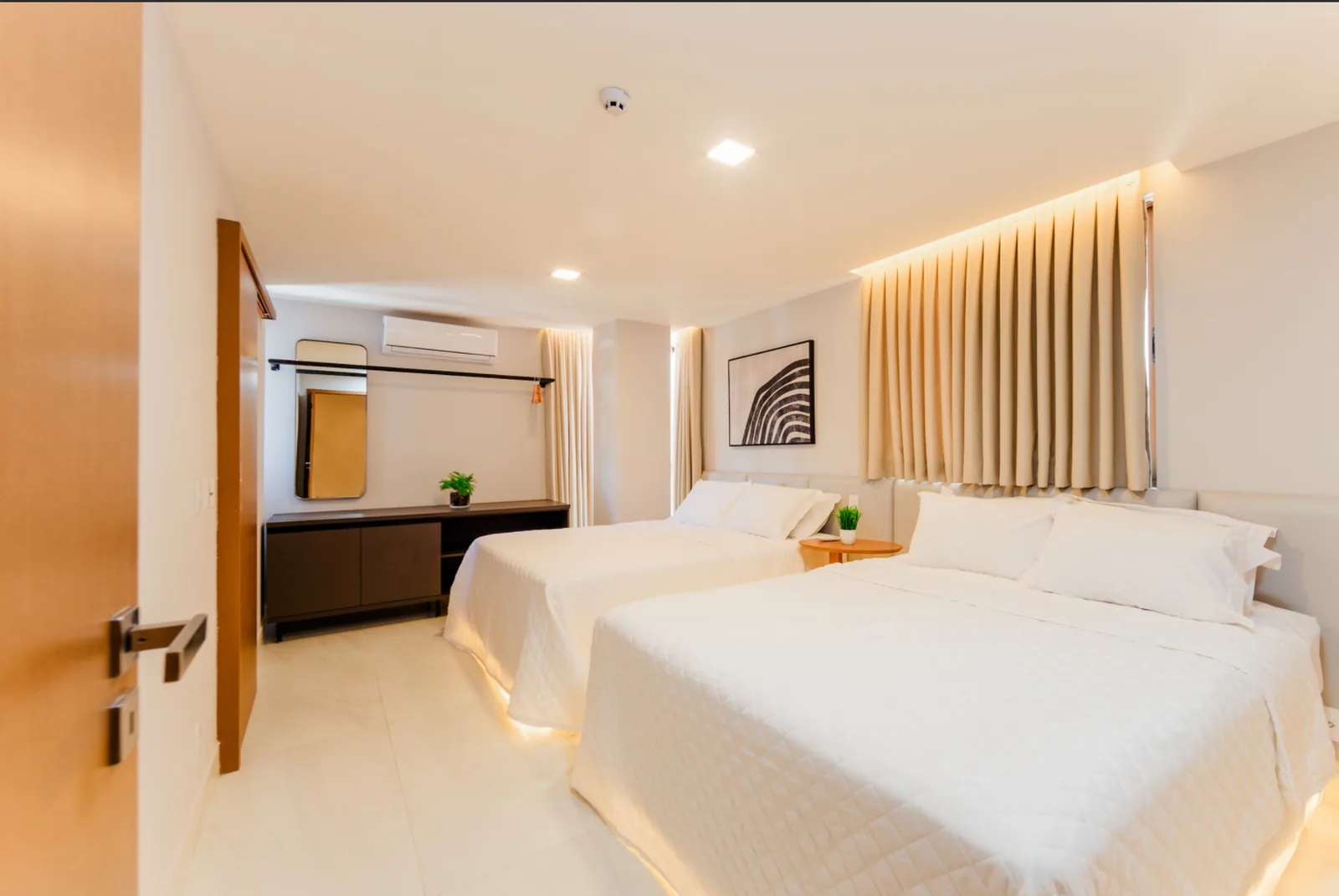 Quarto Quádruplo do Gaudium Flats com duas camas de casal
